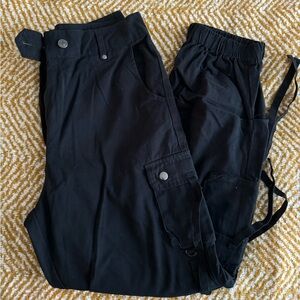 Black cargo pants, jogger style.